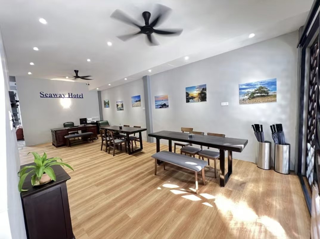 Bright lobby with timber tables and the reception desk